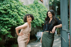 two female videographers relaxed and laughing in new orleans